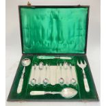 A fitted set of EPNS silver plated cutlery with mother of pearl handles comprising six tea spoons,