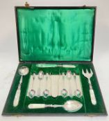 A fitted set of EPNS silver plated cutlery with mother of pearl handles comprising six tea spoons,