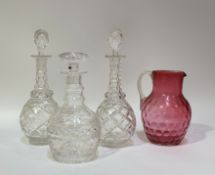 A group of decanters comprising, a Stuart crystal decanter with stopper (h-24cm) a near pair of