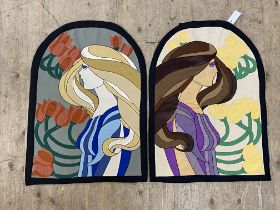 A pair of stitch work wall hanging tapestries simulating stained glass panels in the Art Nouveau