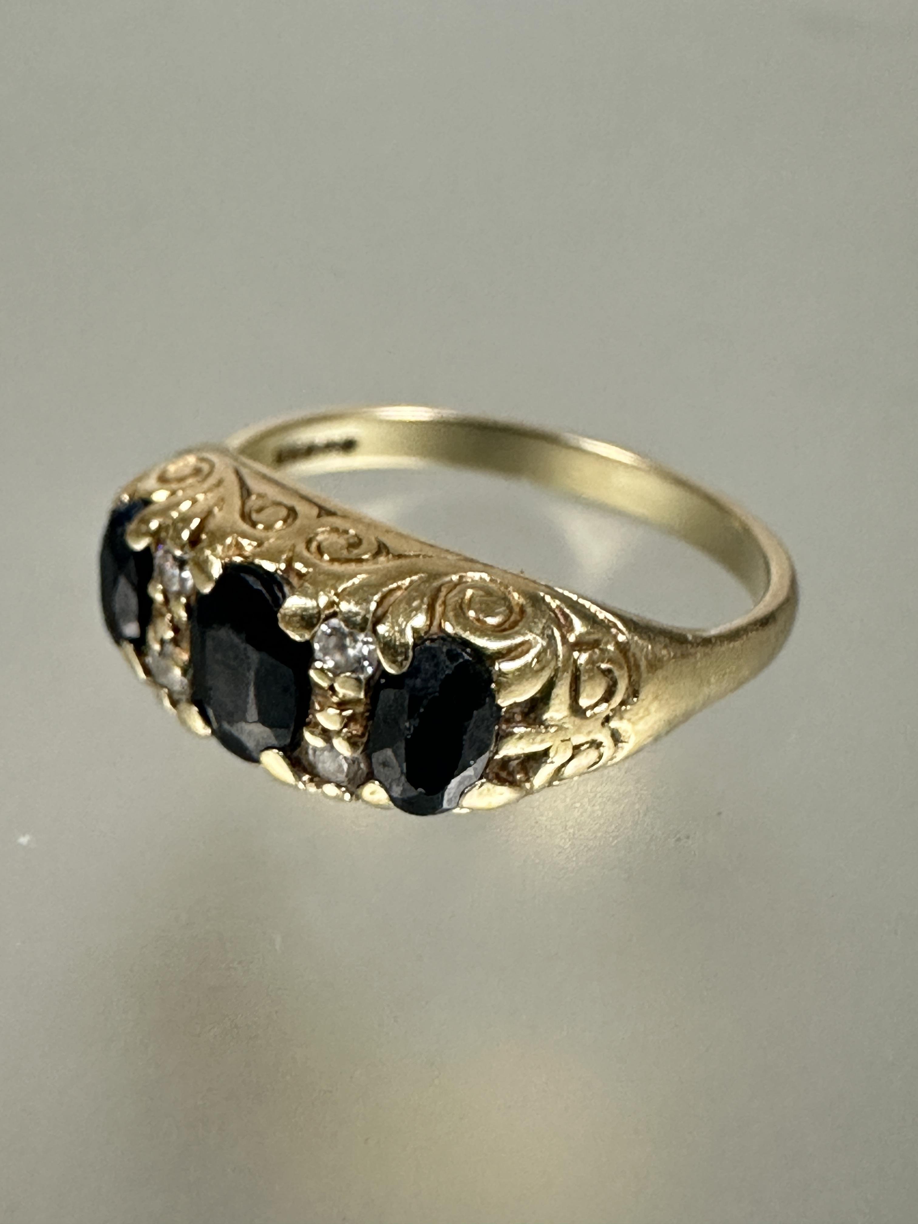 A collection of four various white and yellow metal dress rings and a 9ct gold three stone graduated - Image 2 of 4