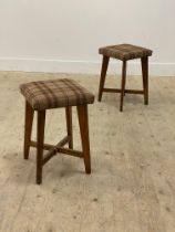 A pair of mid century oak stools, the seats upholstered in Abraham Moon wool. H50cm.