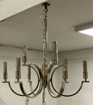 A contemporary chrome plated nine branch pendent light fitting, complete with chain and rose,