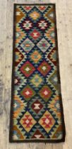 A Maimana kilim runner rug, the dark field with lozenge motif 193cm x 63