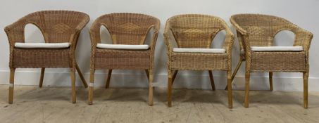 A matched set of four Lloyd Loom style basketwork tub chairs. H88cm.