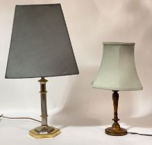 An early 20th century carved and stained beech columnar table lamp with fluted column and circular
