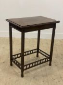 An Edwardian mahogany side table, the rectangular top with moulded edge above fluted square