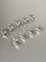 A set of nine George III Edinburgh fiddle and shell pattern tea spoons, Edinburgh 1763  L x 14cm