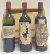 Two bottles of Chateau Latour wine, 1953 (labels deteriorated) together with a bottle of Chateau