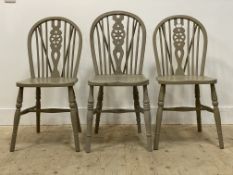 A pair of grey painted Windsor type dining chairs, with hoop spindle and splat back over saddle seat