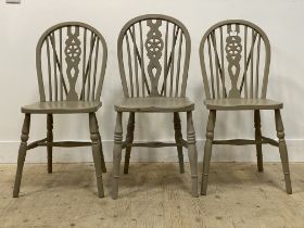 A pair of grey painted Windsor type dining chairs, with hoop spindle and splat back over saddle seat