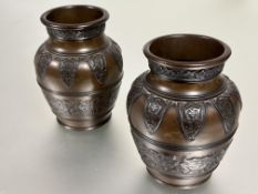 A pair of Japanese late 19thc patinated cast bronze baluster vases the shoulders chased with