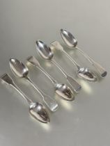 A set of six Georgian silver Fiddle pattern tea spoons with engraved initial F L x 14cm show