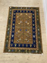 An Indian vegetable died flat weave rug, the field with geometric floral design within a multi