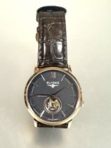 A German Elysee automatic gilt steel cased waterproof wrist watch with gray dial and baton hour