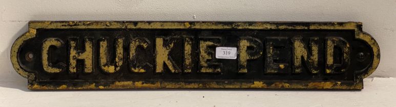 An early 20th century cast iron street sign, reading 'Chuckie Pend' L70cm