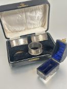 A boxed set of two Edwardian Birmingham silver navette shaped engine turned napkin rings L x 6.5cm