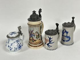 A group of three stoneware German beer steins and a porcelain Bavarian beer stein with pewter