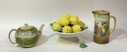 A decorative ceramic lemon centre piece in a lattice basted style footed bowl (h- 21cm w-25cm) (loss