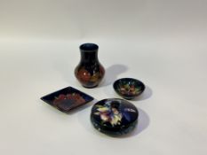 A collection of Moorecroft Pottery comprising, a Pomegranate pattern bud vase (h-13cm), an Anemone