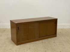 A mid century teak veneered side cabinet, fitted with two sliding doors enclosing a shelf. H48cm,