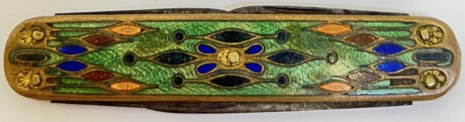 A continental champleve enamelled pen knife with four blades, the case decorated in transparent poly