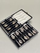 A set of six Sheffield silver boxed coffee spoons with fan shell terminals L 9.5cm Sheffiled 1938