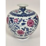 A reproduction Chinese tapered vase decorated with chrysanthemum and scrolling leaf design H x 24cm