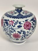A reproduction Chinese tapered vase decorated with chrysanthemum and scrolling leaf design H x 24cm