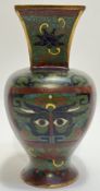 A Meiji period Japanese cloisonne vase decorated in the Chinese taste with archaic style taotie mask
