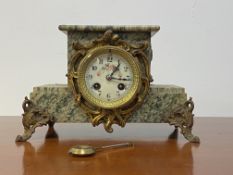 A late 19th century French green serpentine marble mantel clock, with white Ivorine dial, stepped