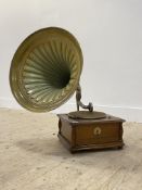 An early 20th century 'Everything under the sun' oak cased wind up gramophone, complete with horn.