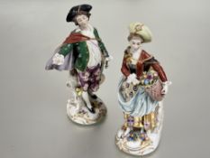 A Continental porcelain 18thc style figure of a Minstrel with tricorn hat and cape with mandolin