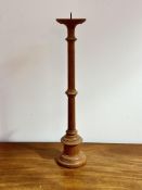 A Fired Earth hardwood pricket style circular tapered altar stick on stepped base, sticker verso H x