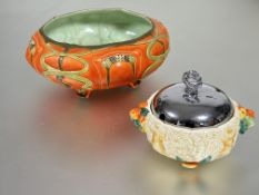 A  Austrian Art Nouveau fruit bowl with molded scrolling glazed leaf and flower head design in pea