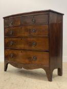 A Regency mahogany bow front chest, fitted with two short and three long graduated drawers, raised