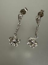 A pair of 18ct white gold Edwardian style diamond daisy flower head drop earrings with miligrain set