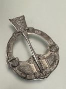 A 1920s  Hamilton and Inches Edinburgh large silver penannular celtic brooch with stylized serpents,