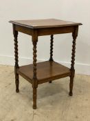 A 1930's oak side table, the square top raised on spiral turned supports united by an under tier.