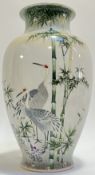 A large Japanese enamelled porcelain vase decorated with cranes and bamboo (three character mark ver