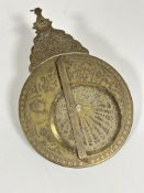 Property of the late Countess Haig , a eastern engraved brass zodiac shaped panel with revolving