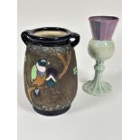 A Austrian Amphora pottery twin handled impress vase of tapered form with enamel parrot,  flowers