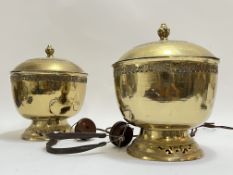 A pair of large embossed brass urns/lidded containers (h- 28cm, w- 22cm) together with a set of B.
