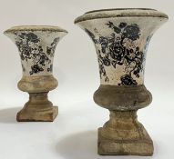 A pair of glazed and transfer printed ceramic or composite garden/architectural trumpet/Campagna