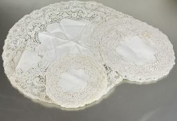 A Edwardian Brussels lace bordered table linen set comprising table center piece D x 53cm set of