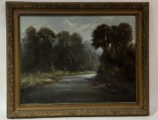 A  Late 19thc school, riverbank forest scene, oil on canvas, unsigned, in a gilt composition