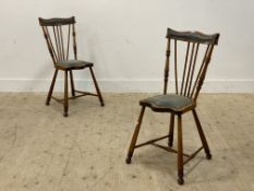 A pair of Arts and Crafts period stained beech and walnut side chairs, with serpentine crest rail