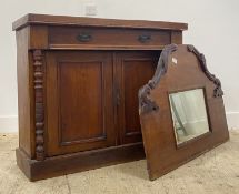A late Victorian mahogany the raised mirror back above a drawer and twin panelled cupboard doors
