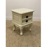 A French style cream finish bedside chest fitted with two drawers, raised on cabriole supports.