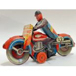 A vintage 'Speed King' tin plated mechanical motorcycle toy (marked 'MTY Made in GT Britain',